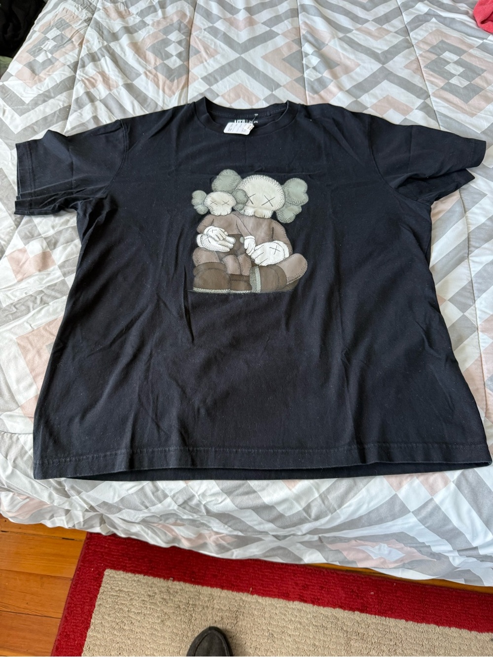Kaws Men’s  Black Graphic Tee with Plush Character